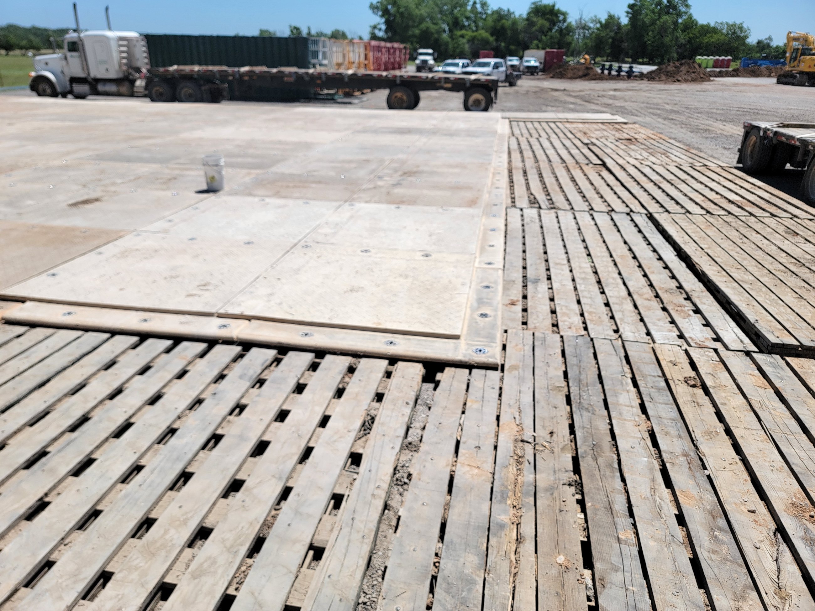 Combination timber and composite matting on site